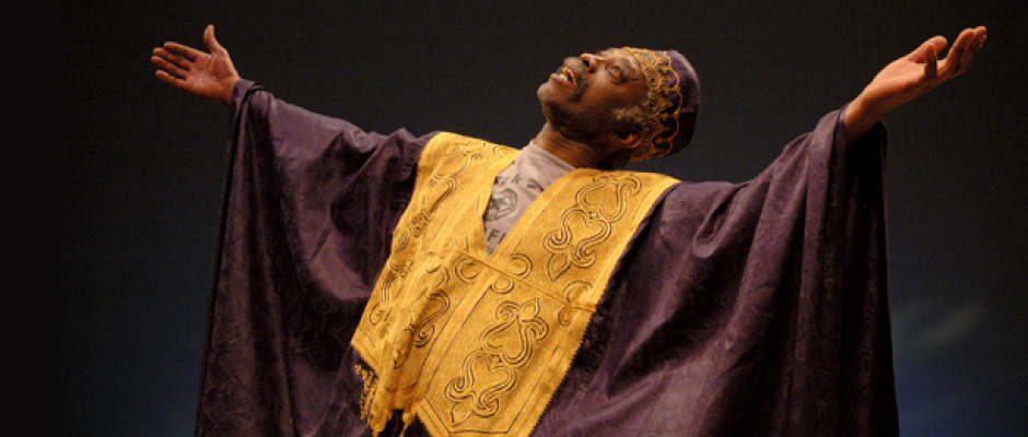 Carlyle in a traditional purple and gold African dress